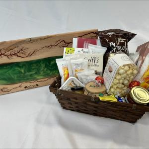 Gift basket with food items and a charcuterie board
