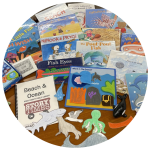 photo of books, ocean animal cutouts, puzzles and other ocean-related manipulatives